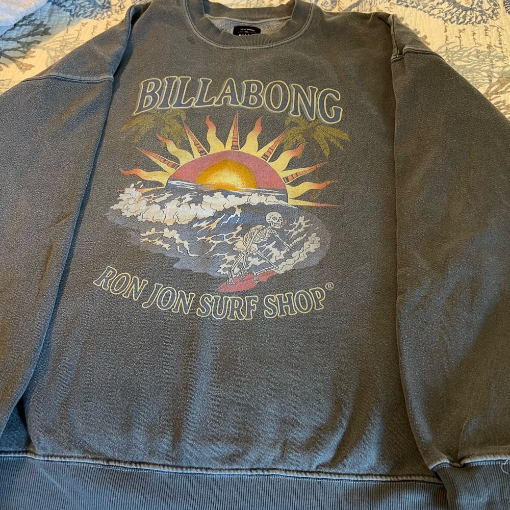 Billabong sweatshirt size medium, blue/black faded color. Small spot near top.